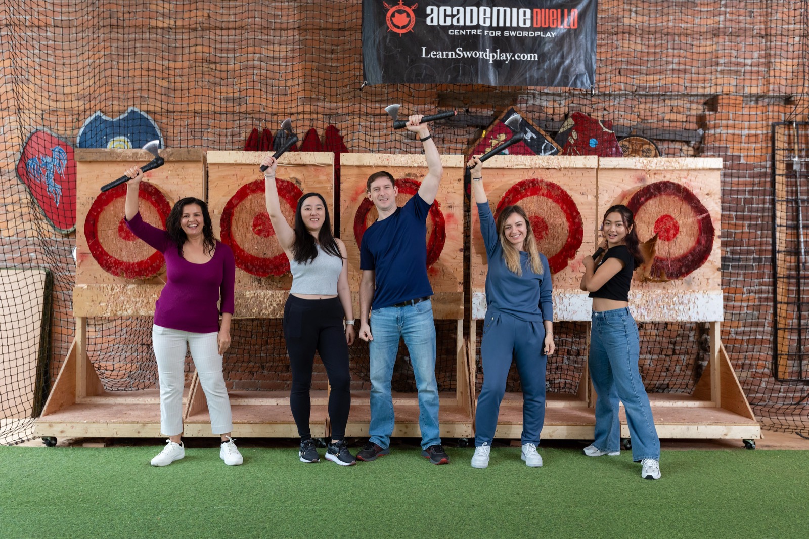 Group enjoying axe throwing at Academie Duello