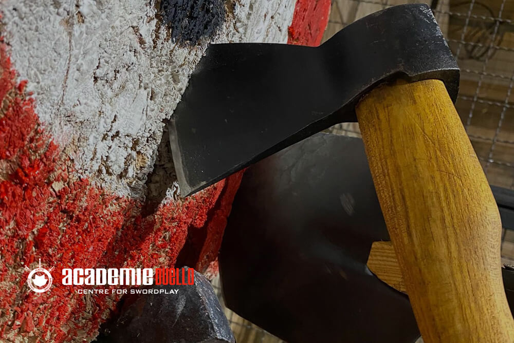 Person throwing axe at target for stress relief